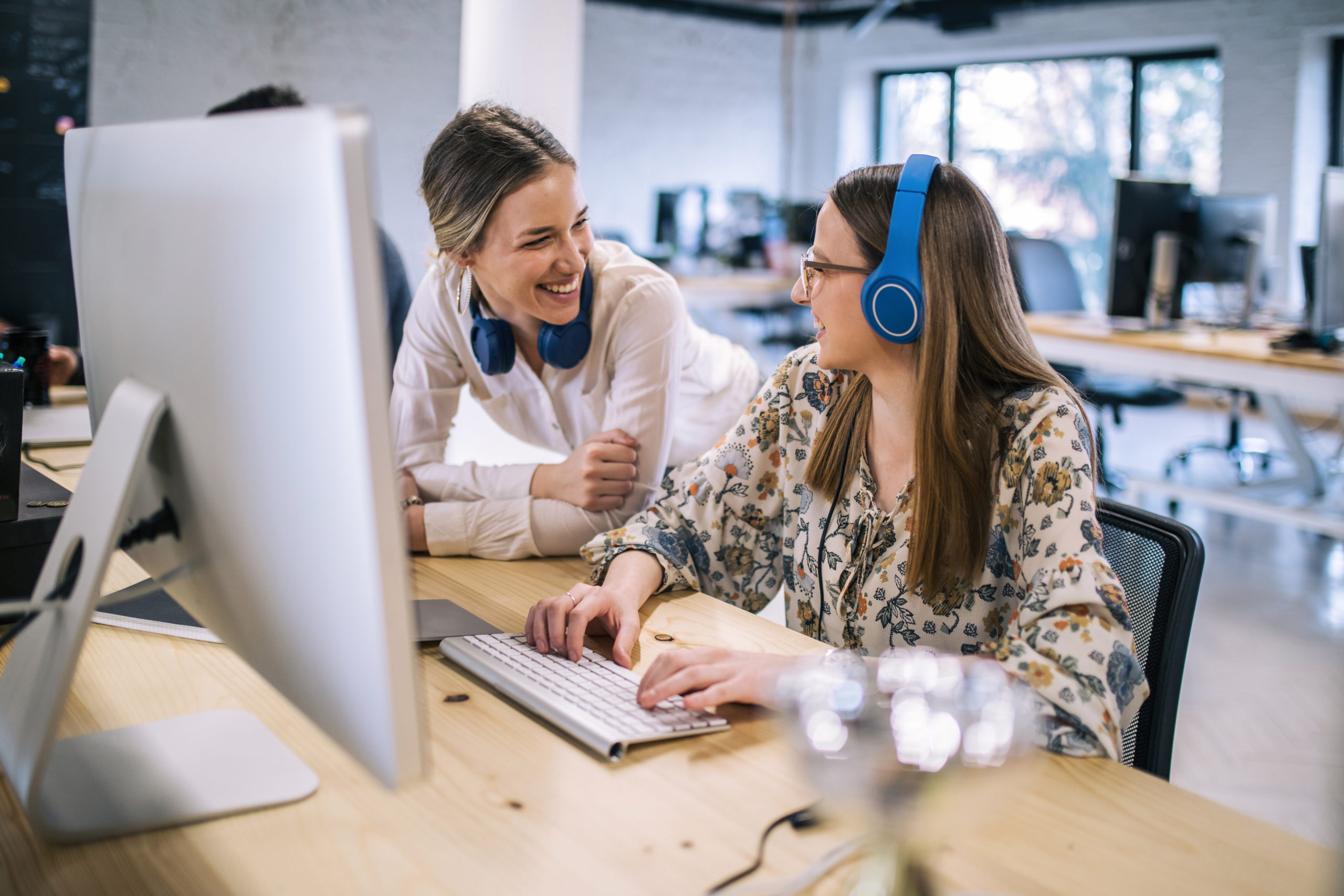Cheerful coworkers working at the IT center
